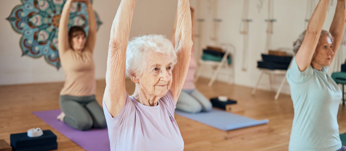 Elderly,Woman,,Yoga,And,Stretching,In,Class,For,Healthy,Spiritual,