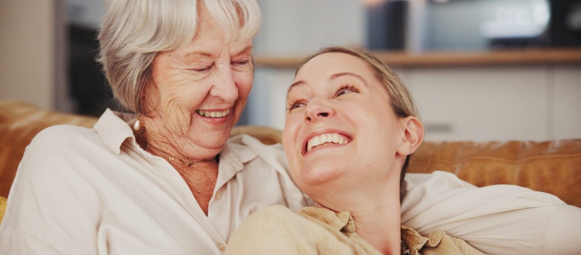 Happy,,Sofa,And,Mature,Mother,With,Daughter,Laughing,Together,For